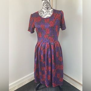 LulaRoe Amelia, size L, 97% polyester, 3% spandex .  Red, purple green, & black.